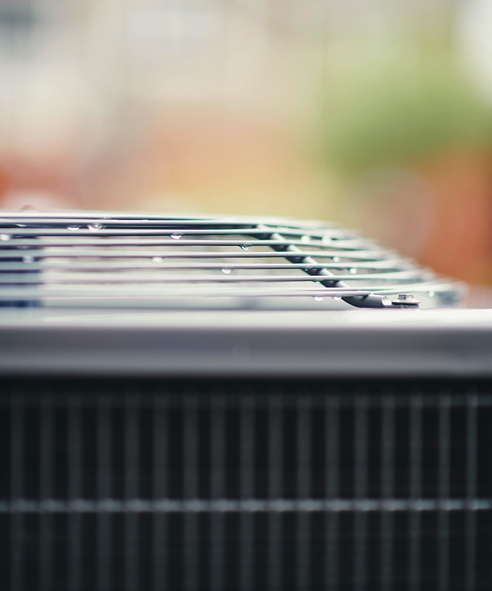 Repairman conducting an air conditioner recharge